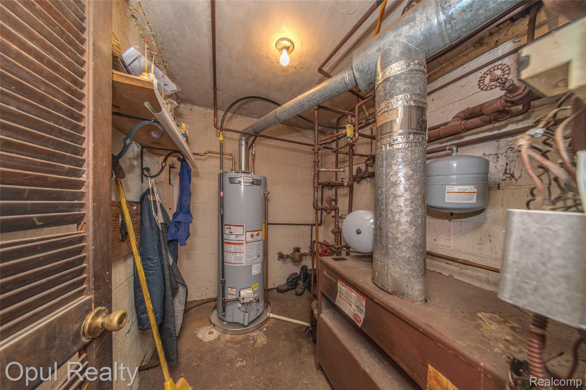 6455 Norham Road Bloomfield Hills, MI 48301 - Photo 65 of 93 Utility area featuring a water heater, furnace system, and exposed ductwork