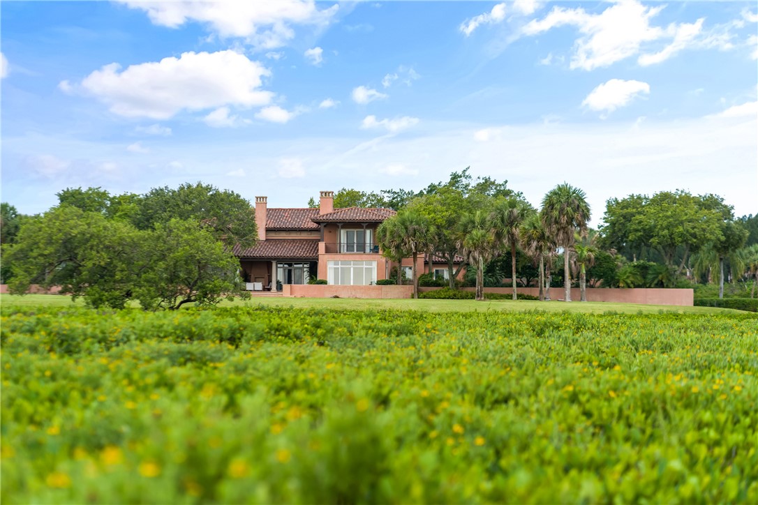 2350 Quay Dock Road Vero Beach, FL 32967 - Photo 30 of 35 a view of a house with a big yard plants and large trees