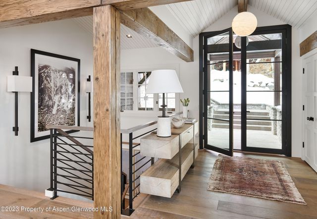 a kitchen with stainless steel appliances a stove and more cabinets