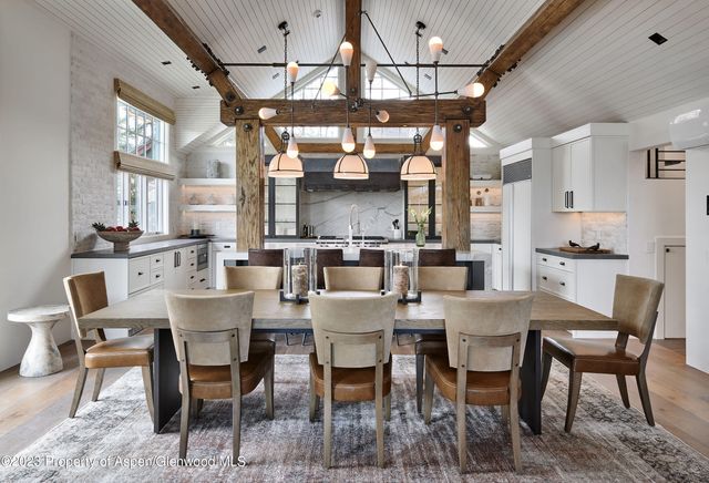 a spacious bathroom with a granite countertop sink and a mirror