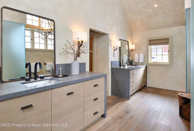 a living room with furniture a table and a large window