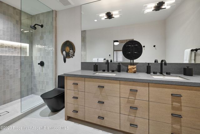 a view of a house with a snow in the yard