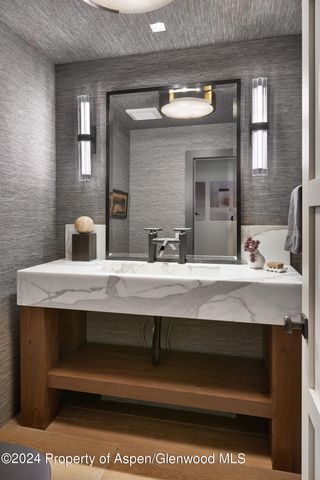 a bathroom with a sink and a mirror