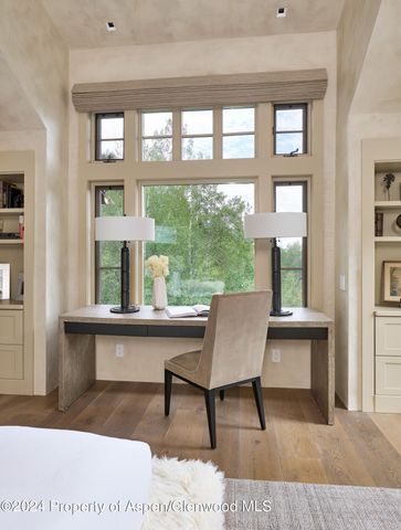 a view of a floor to ceiling window and wooden floor