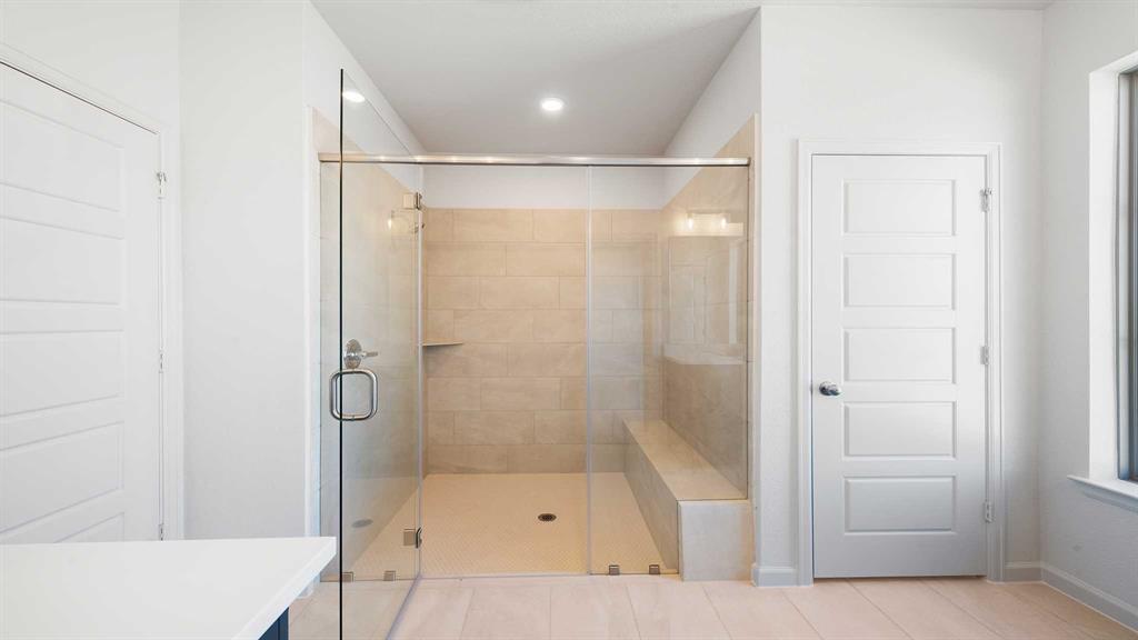 6108 Vester Trail Fate, TX 75087 - Photo 16 of 21 a bathroom with a shower and a tub