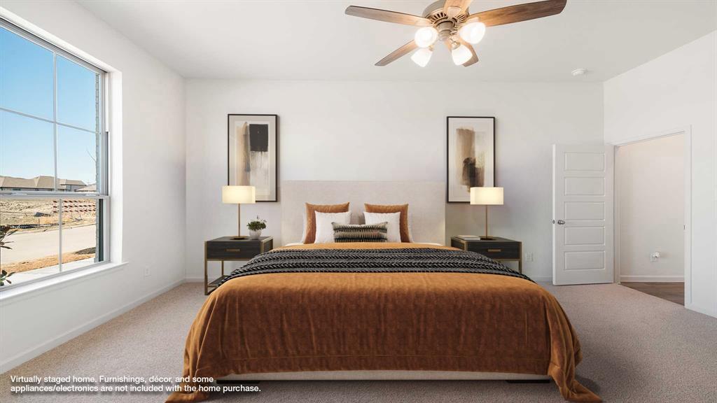 6108 Vester Trail Fate, TX 75087 - Photo 7 of 21 a bedroom with a bed and window