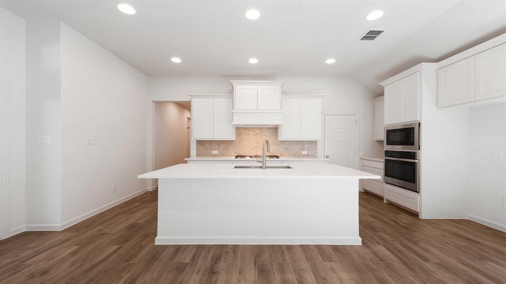 6108 Vester Trail Fate, TX 75087 - Photo 10 of 21 a view of kitchen with wooden floor