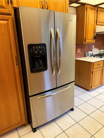 a white stove top oven sitting next to a window
