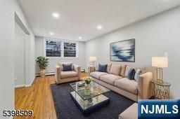 357 Franklin Street Bloomfield, NJ 07003 - Photo 4 of 17 a living room with furniture and a flat screen tv