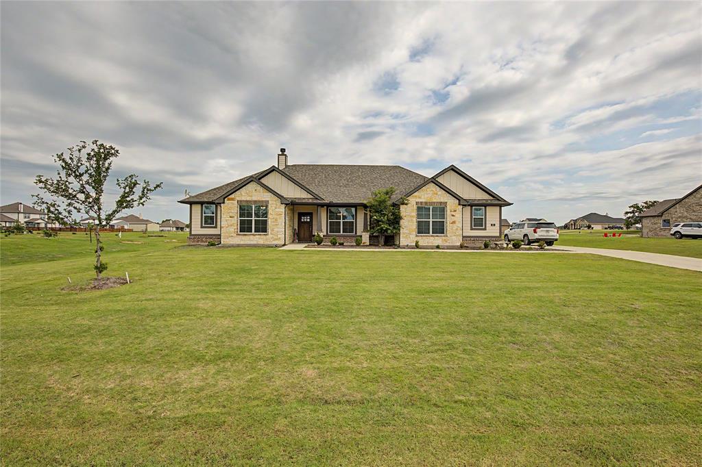 185 Chester Road Springtown, TX 76082 - Photo 6 of 40 Ranch-style residence featuring a stone and siding facade, a gabled roofline, and a prominent front entry