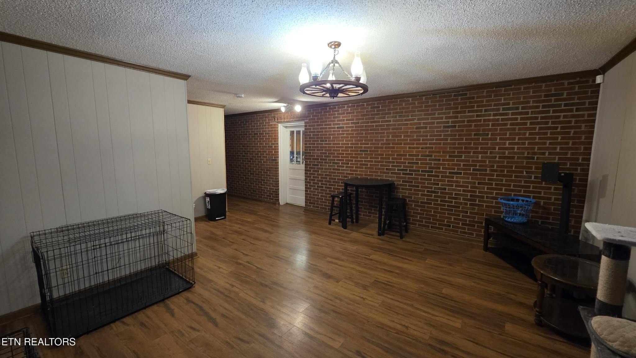 992 Walden Ridge Lane Caryville, TN 37714 - Photo 30 of 58 a room with wooden floor and a fireplace