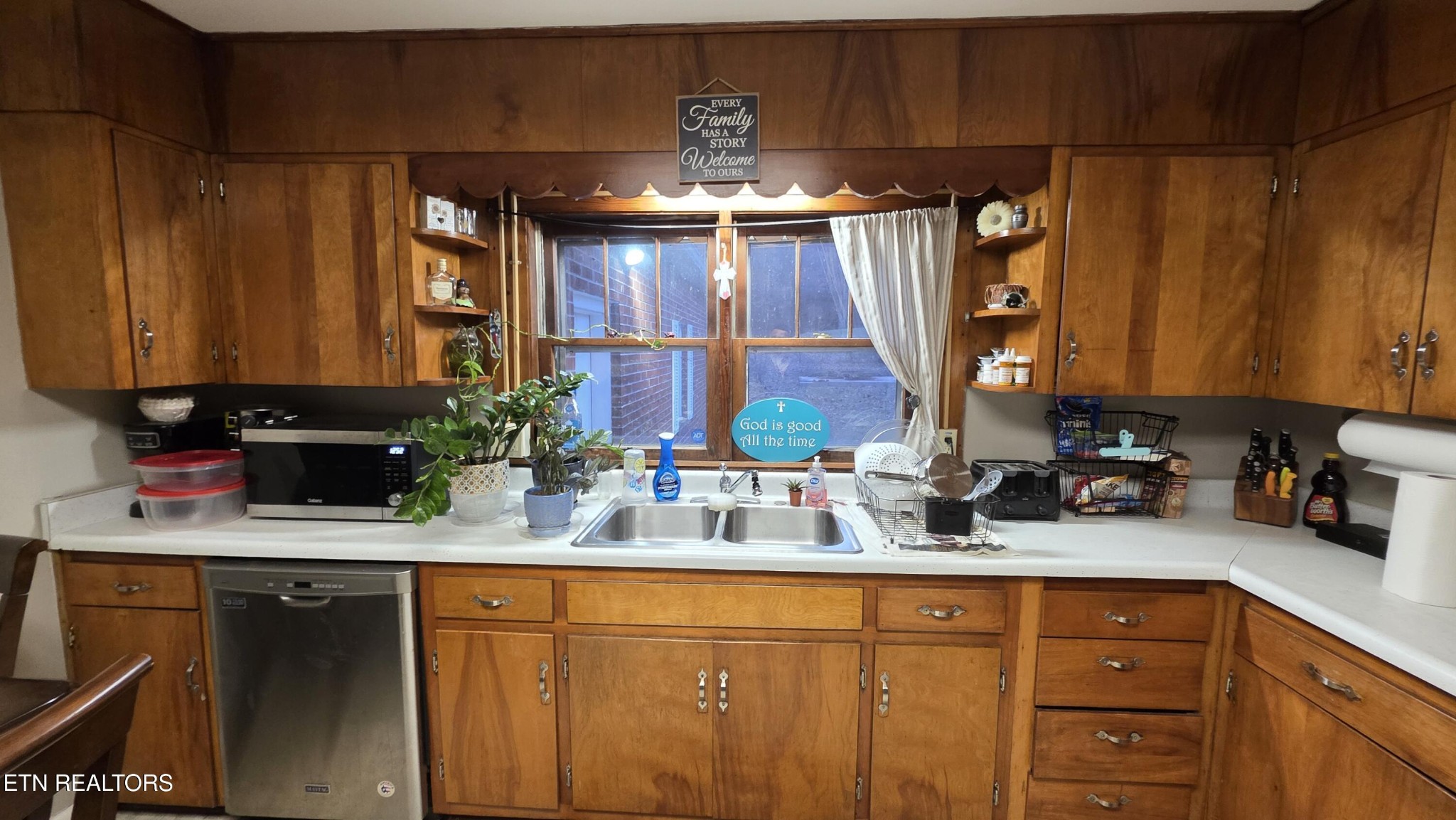 992 Walden Ridge Lane Caryville, TN 37714 - Photo 36 of 58 a kitchen with stainless steel appliances granite countertop a sink a stove and a wooden cabinets