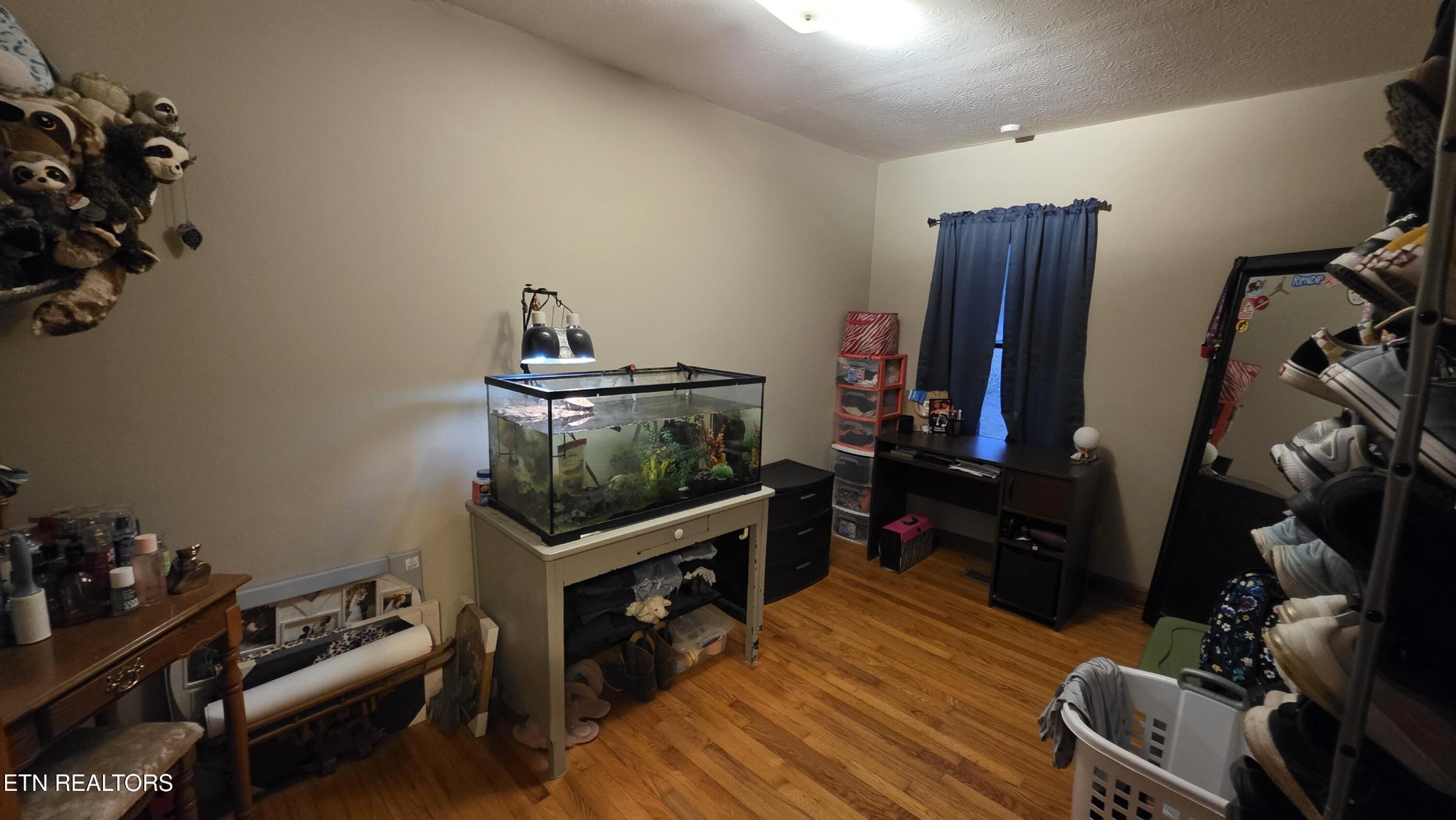 992 Walden Ridge Lane Caryville, TN 37714 - Photo 44 of 58 a living room with furniture a flat screen tv and gym equipment