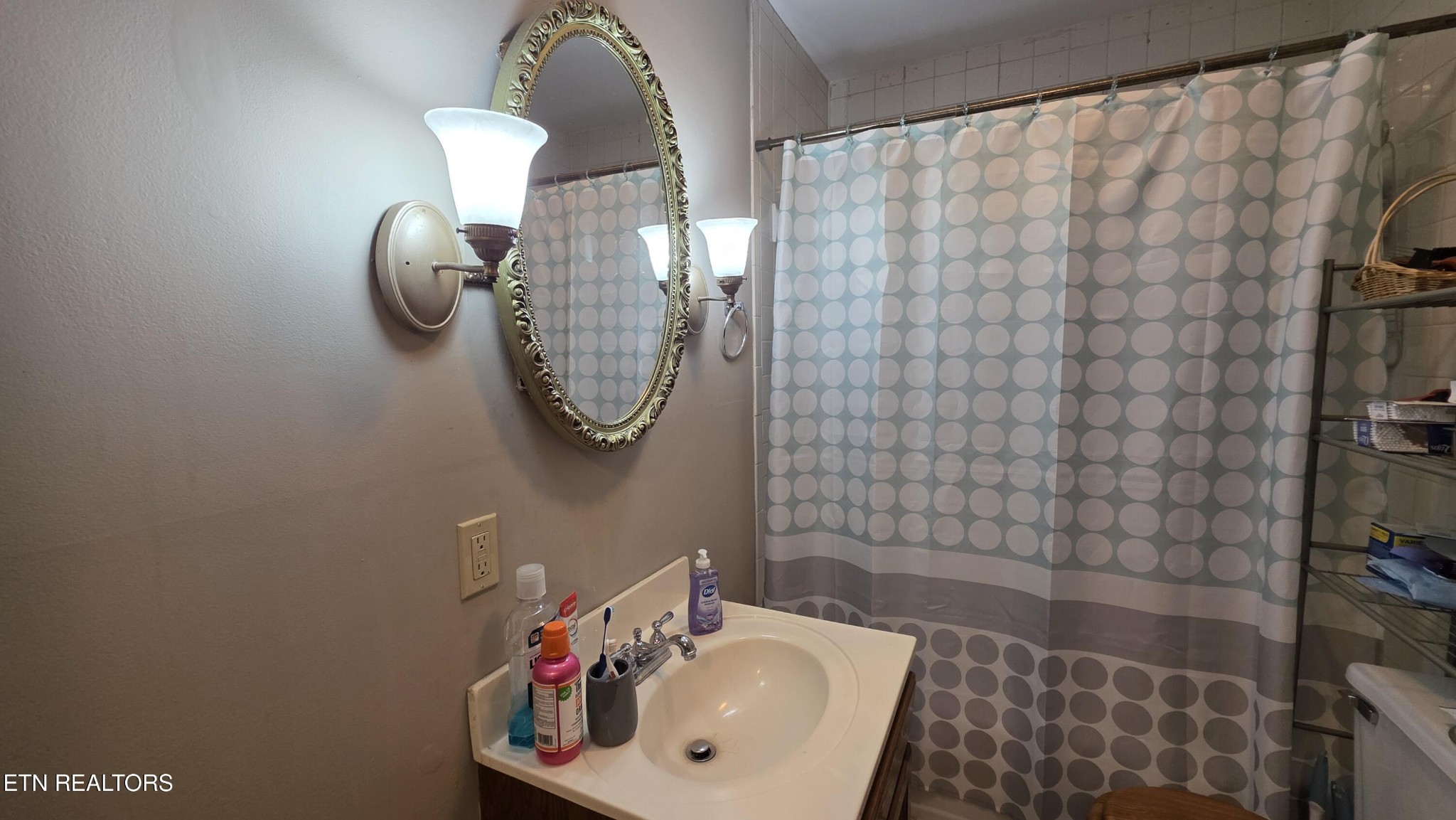 992 Walden Ridge Lane Caryville, TN 37714 - Photo 47 of 58 a bathroom with a sink a mirror and shower