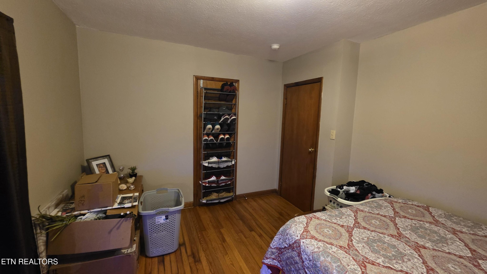 992 Walden Ridge Lane Caryville, TN 37714 - Photo 49 of 58 a bedroom with a bed and a wooden floor