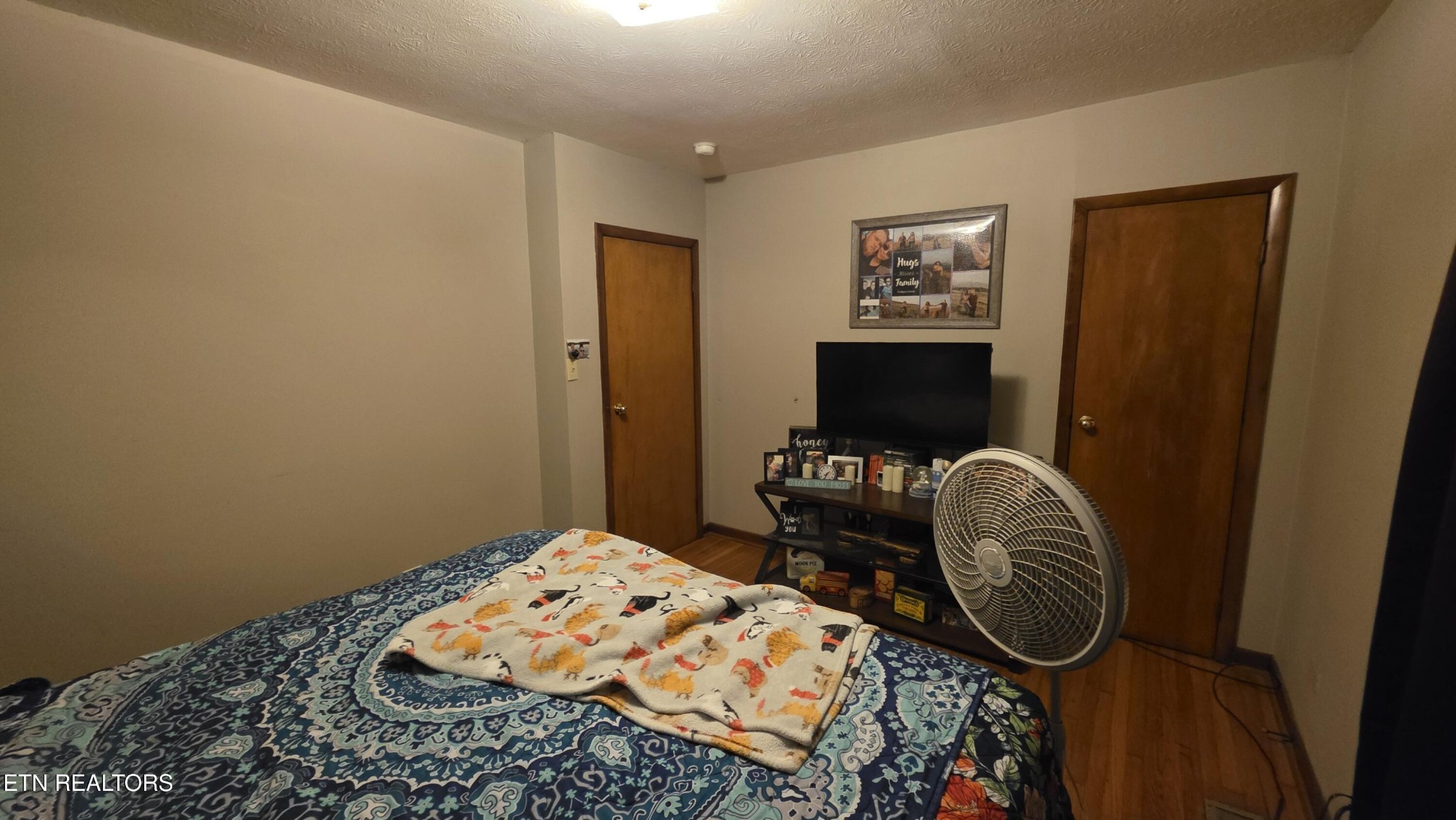 992 Walden Ridge Lane Caryville, TN 37714 - Photo 52 of 58 a bedroom with a bed and wooden floor