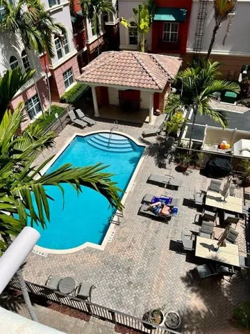a view of a chairs and table in backyard