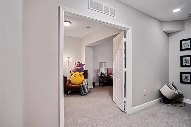 a bedroom with a bed and a car