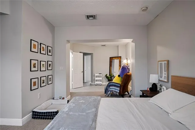 a bathroom with a tub a double vanity sink a window and a mirror