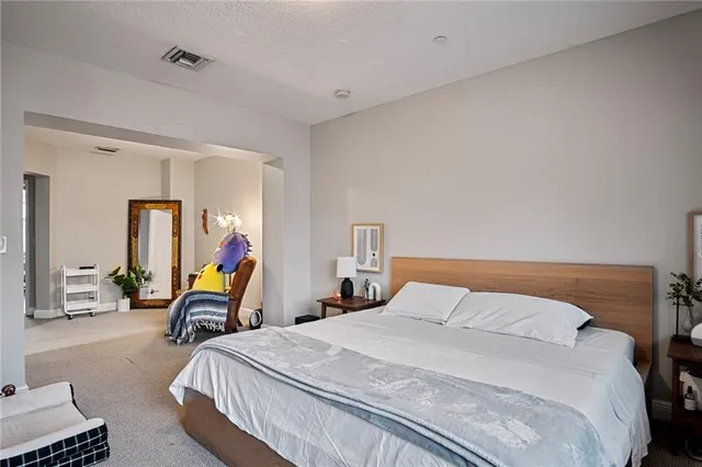 a bathroom with a tub a sink a mirror and a shower
