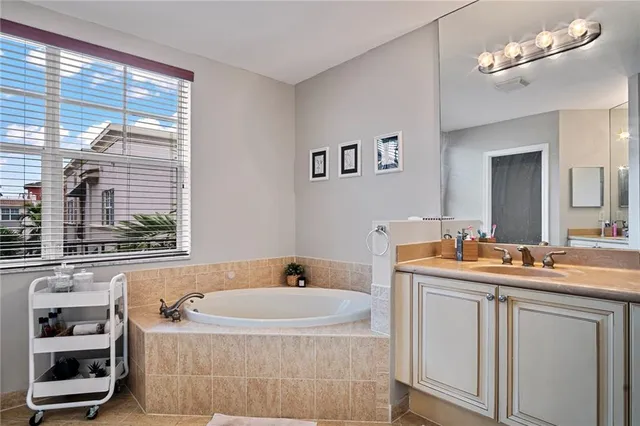 a en suite bathroom with a sink a toilet and a mirror