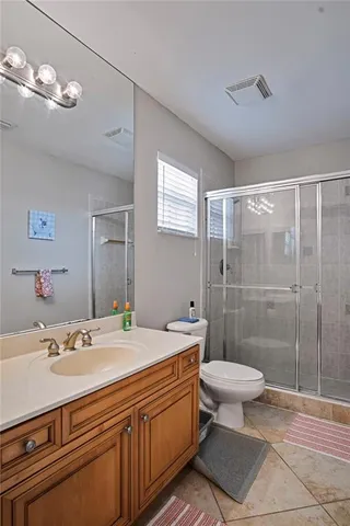 a living room with furniture and a bookshelf