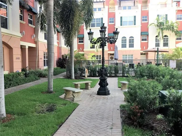 a swimming pool with outdoor seating and yard