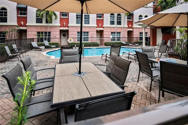 a view of a street with palm trees