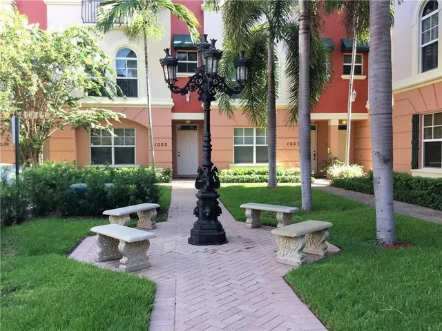 a view of a street with a building in the background