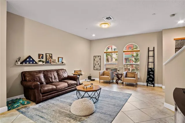 a living room with furniture and a large window