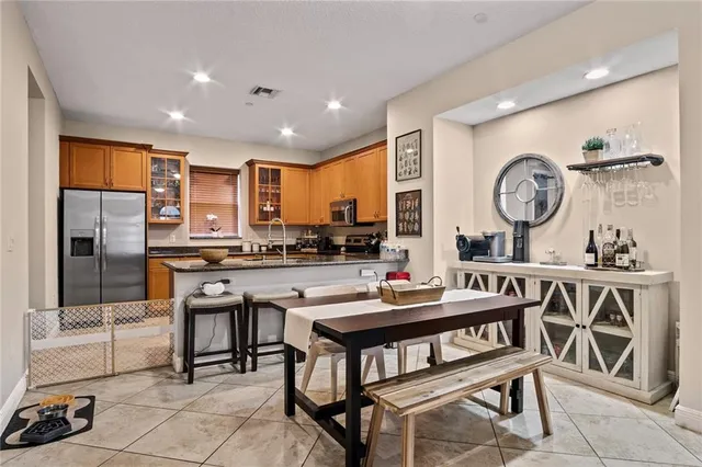 a kitchen with granite countertop a sink and cabinets