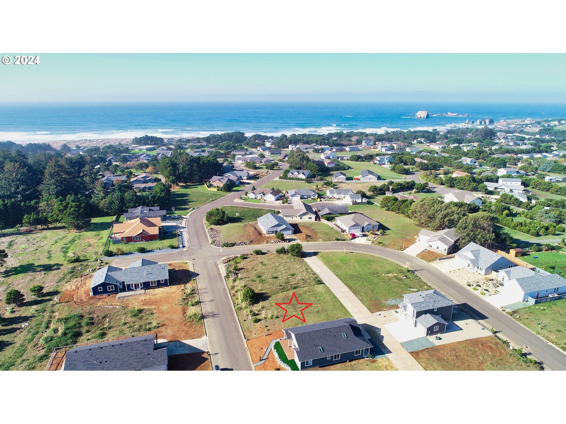848 Seacrest Drive Bandon, OR 97411 - Photo 2 of 24 an aerial view of residential houses with outdoor space