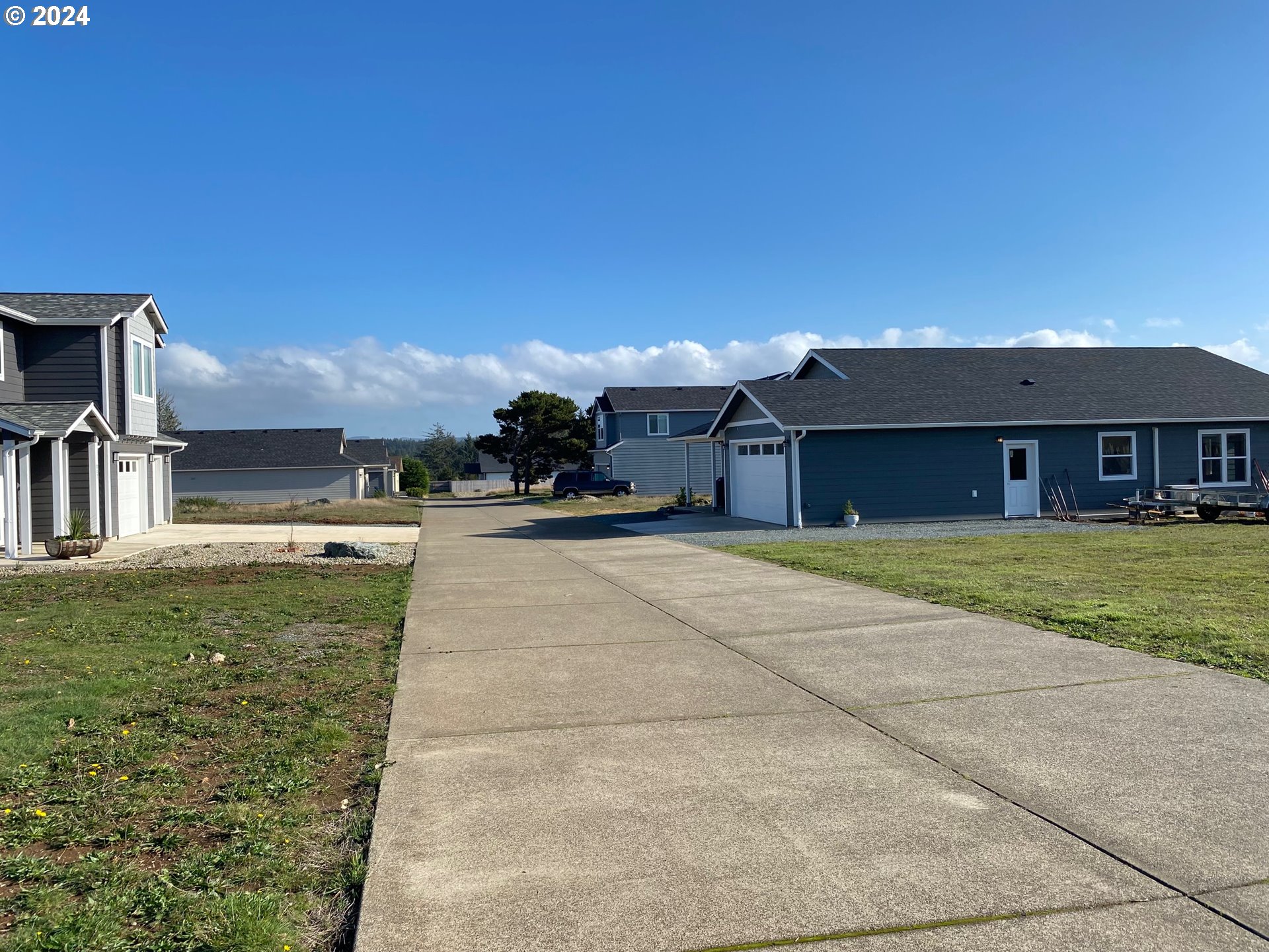 848 Seacrest Drive Bandon, OR 97411 - Photo 10 of 24 a view of a house with a yard