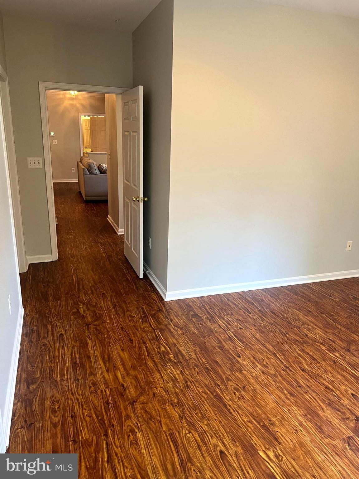431 Hopkins Landing Drive, Unit 431 Baltimore, MD 21221 - Photo 16 of 30 a view of an empty room and wooden floor