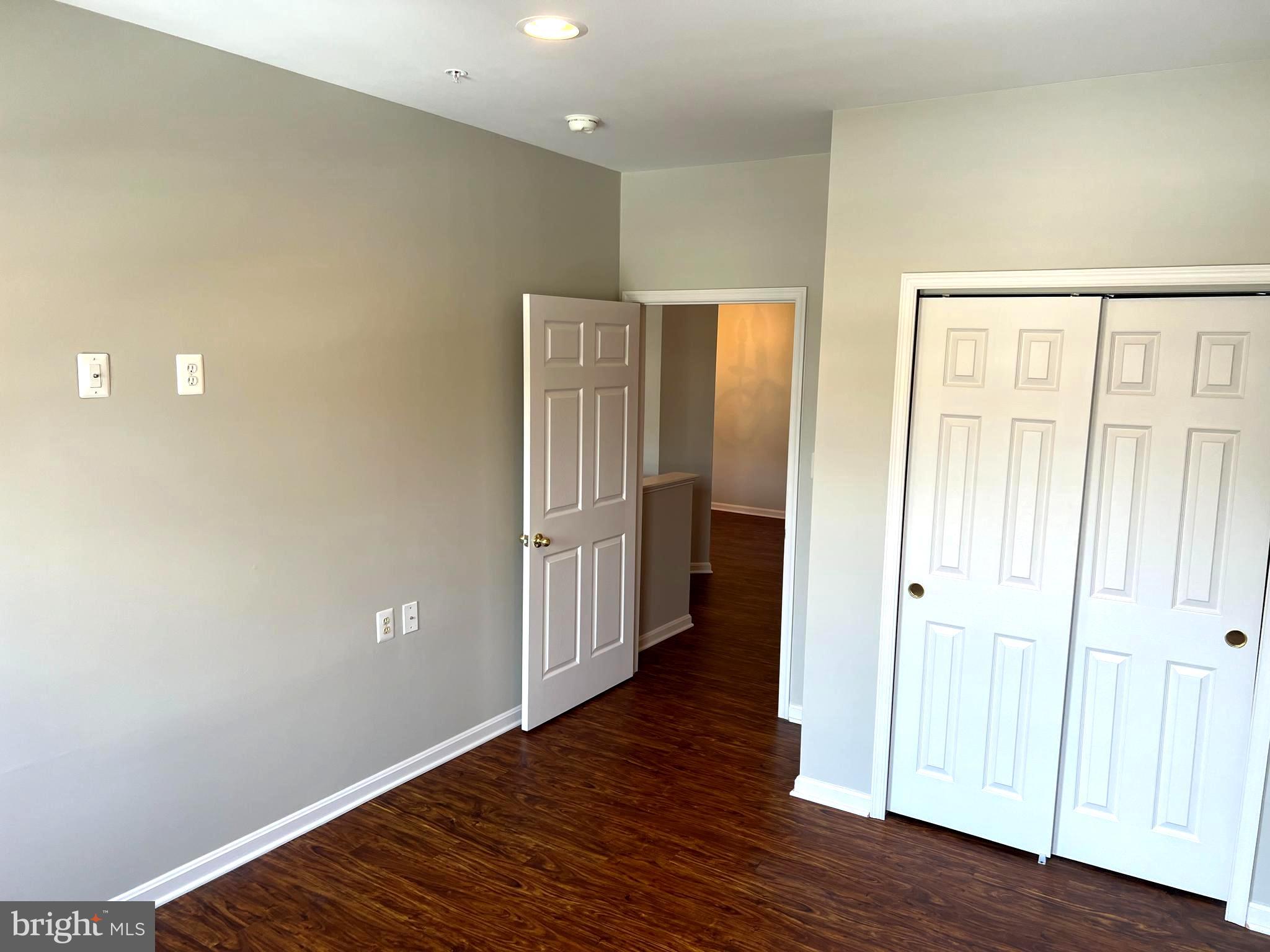 431 Hopkins Landing Drive, Unit 431 Baltimore, MD 21221 - Photo 23 of 30 a view of a hallway with wooden floor