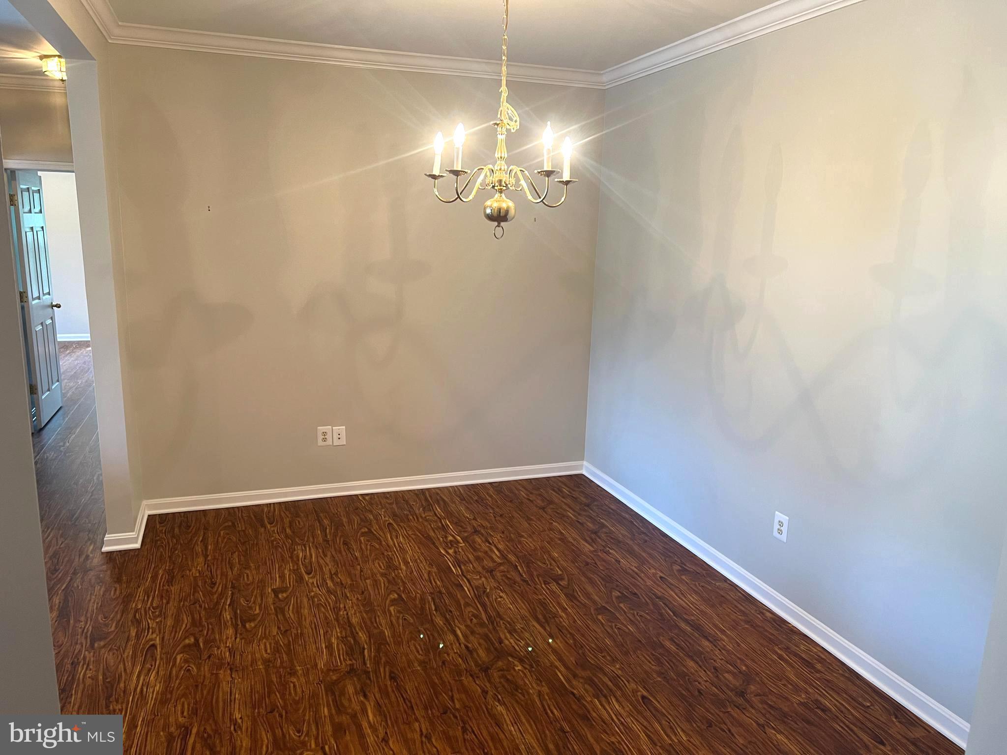 431 Hopkins Landing Drive, Unit 431 Baltimore, MD 21221 - Photo 25 of 30 a view of a room with wooden floor and fan