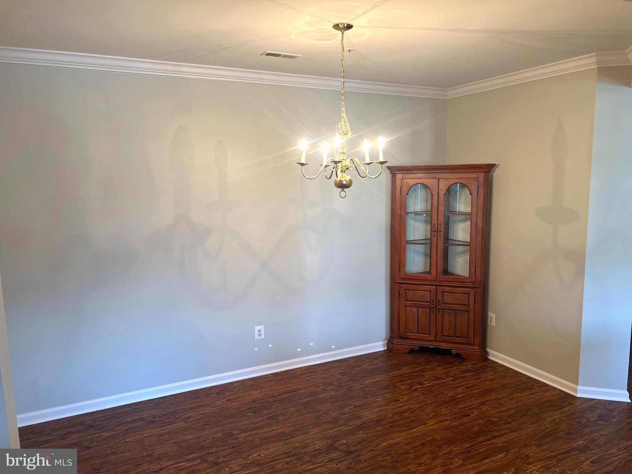 431 Hopkins Landing Drive, Unit 431 Baltimore, MD 21221 - Photo 26 of 30 wooden floor in an empty room with a window