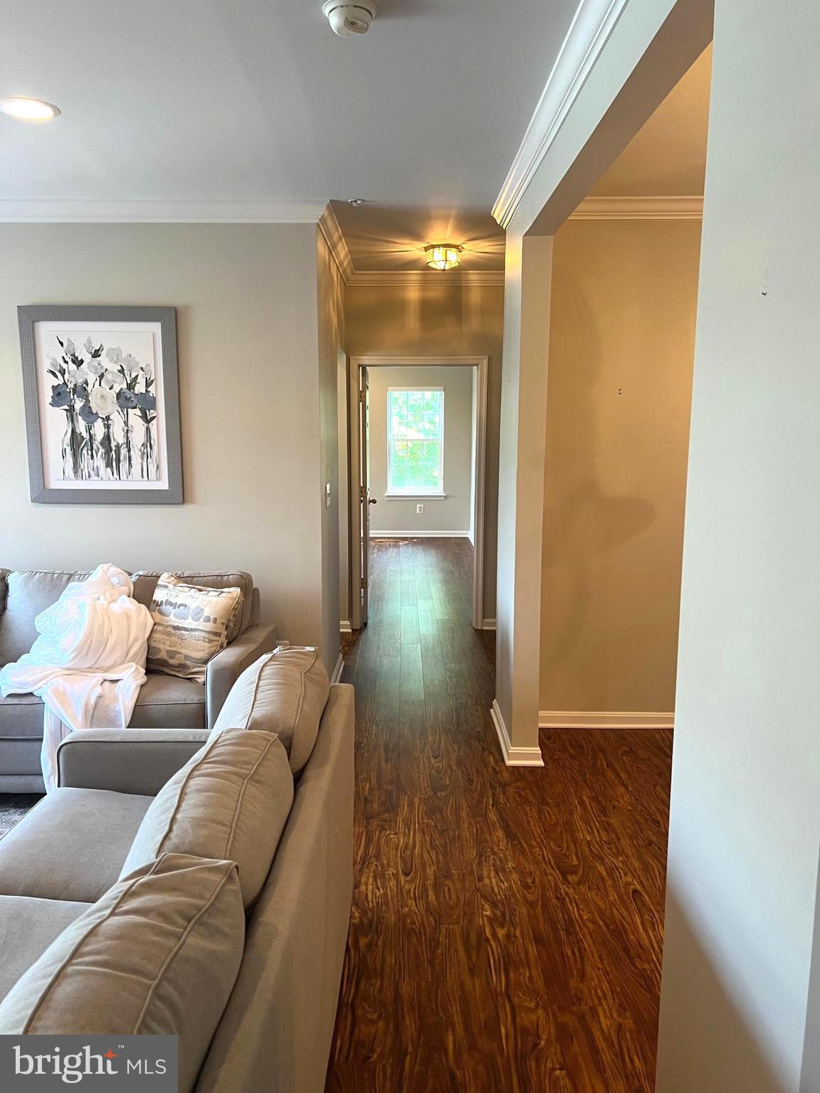 431 Hopkins Landing Drive, Unit 431 Baltimore, MD 21221 - Photo 3 of 30 a living room with a couch and a table