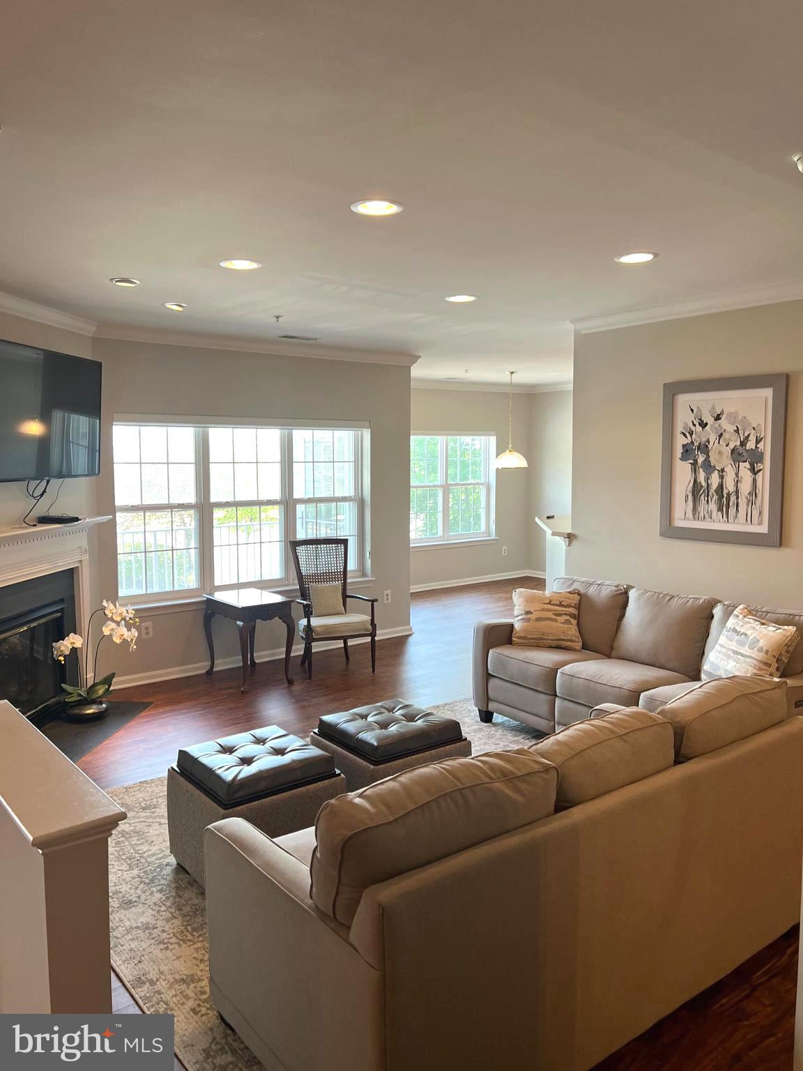 431 Hopkins Landing Drive, Unit 431 Baltimore, MD 21221 - Photo 5 of 30 a living room with furniture and a large window