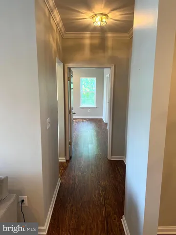 a view of gallery with wooden floor