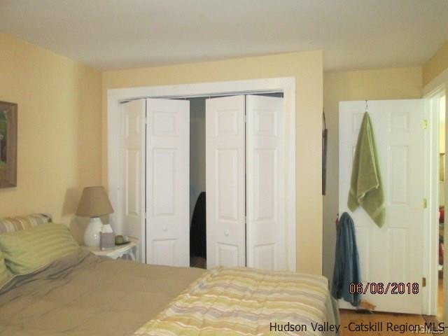 309 Schroon Hill Road Kerhonkson, NY 12446 - Photo 13 of 21 a bedroom with a bed and a window