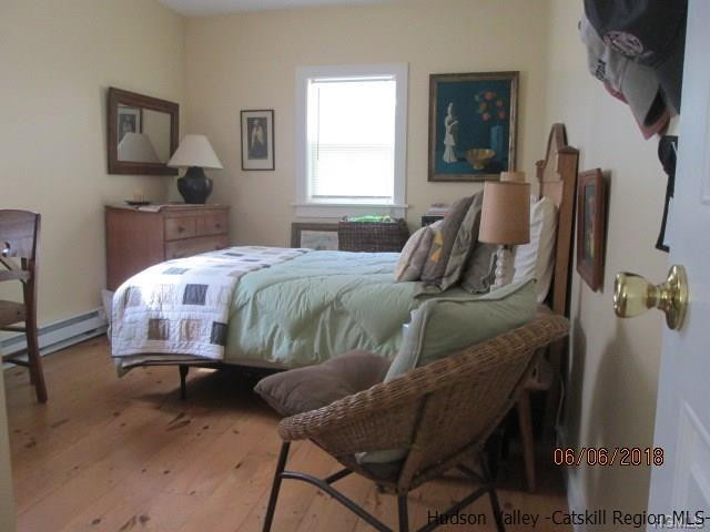 309 Schroon Hill Road Kerhonkson, NY 12446 - Photo 15 of 21 a bedroom with a bed and a window