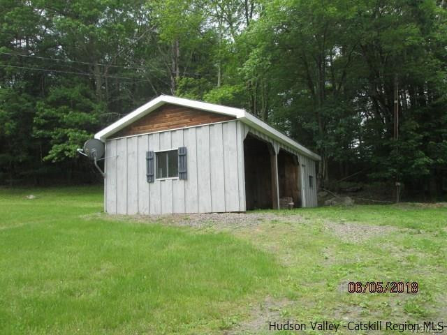 309 Schroon Hill Road Kerhonkson, NY 12446 - Photo 17 of 21 a view of a small house with a small yard