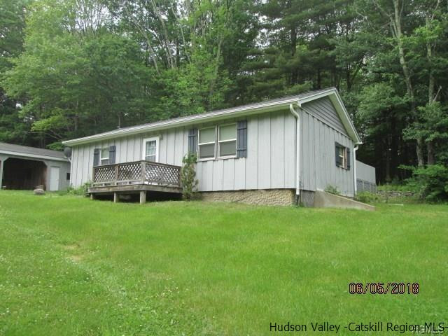 309 Schroon Hill Road Kerhonkson, NY 12446 - Photo 20 of 21 a view of a house with backyard and garden