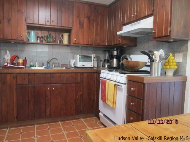 309 Schroon Hill Road Kerhonkson, NY 12446 - Photo 2 of 21 a kitchen with stainless steel appliances a stove a cabinets and a refrigerator