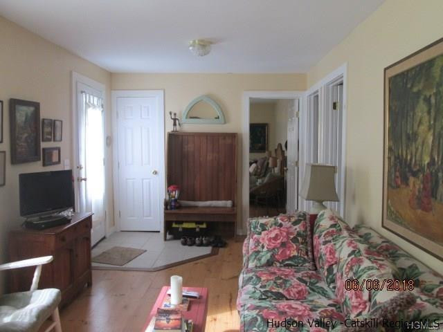 309 Schroon Hill Road Kerhonkson, NY 12446 - Photo 6 of 21 a living room with furniture and a flat screen tv