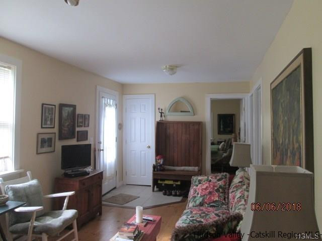 309 Schroon Hill Road Kerhonkson, NY 12446 - Photo 8 of 21 a living room with furniture and a flat screen tv