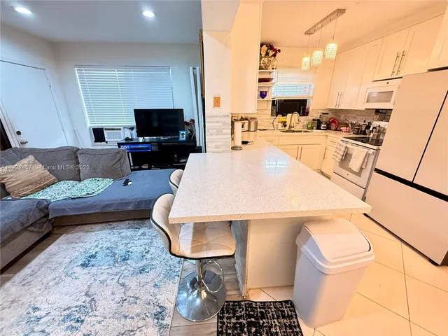 a bedroom with a bed and cabinets
