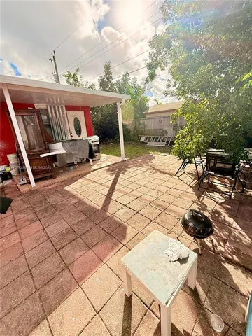 a kitchen with cabinets and white appliances