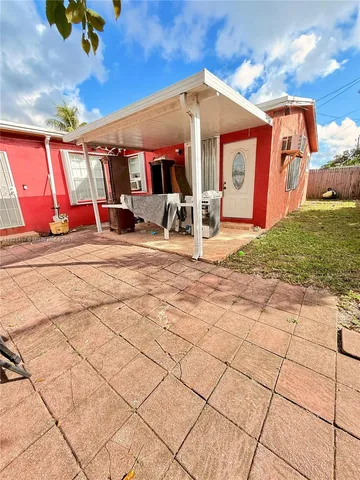 a bedroom with a bed and ceiling fan